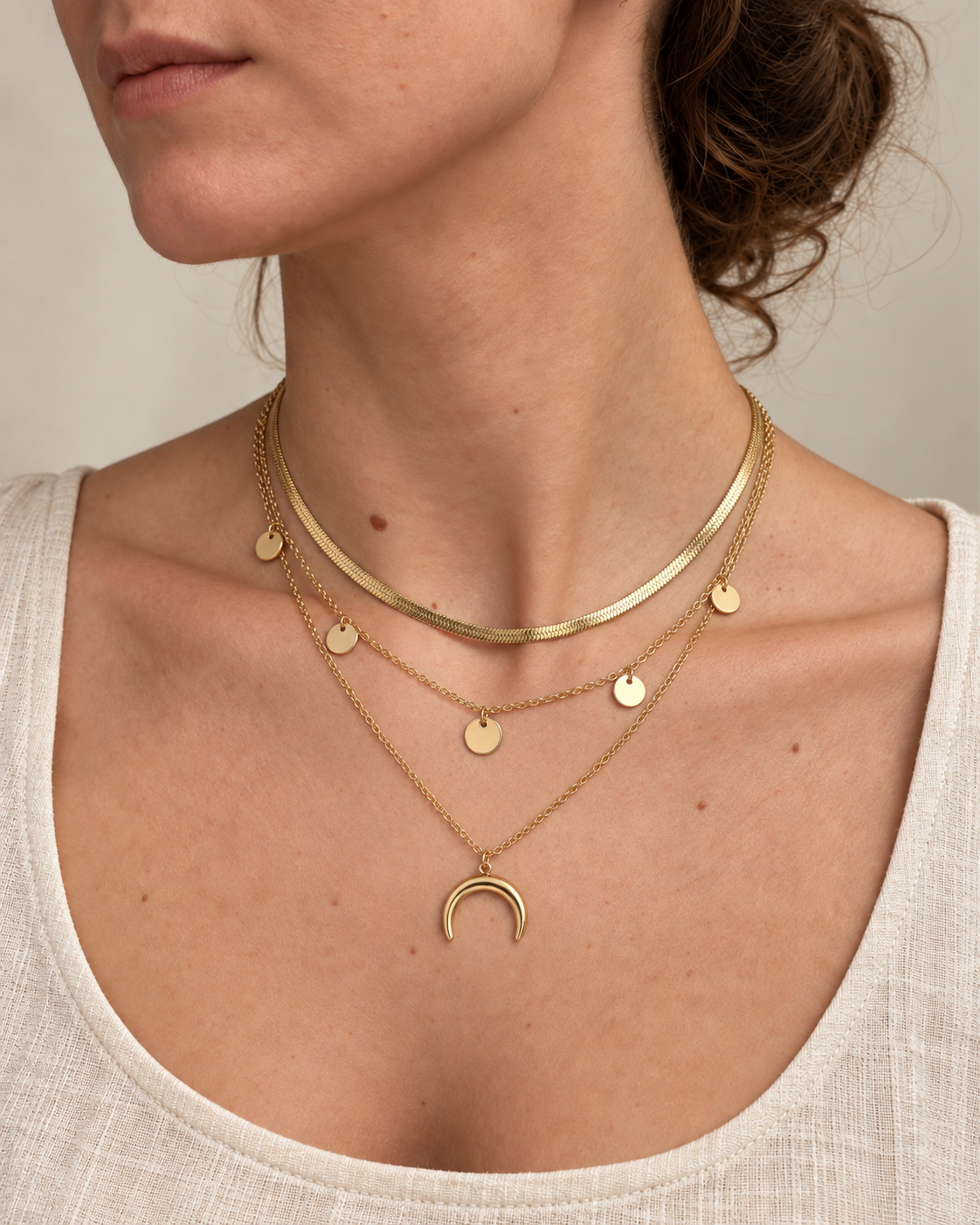 Golden Crescent Layer Set gold-tone layered necklace with on a female model