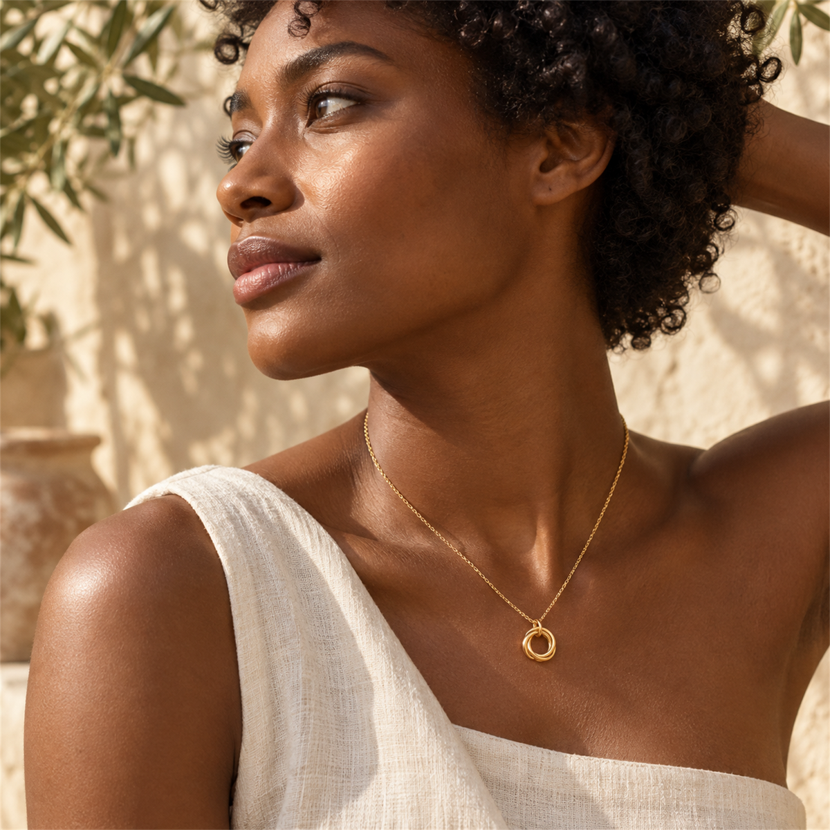 Twisted Harmony Necklace gold-tone necklace on a female model