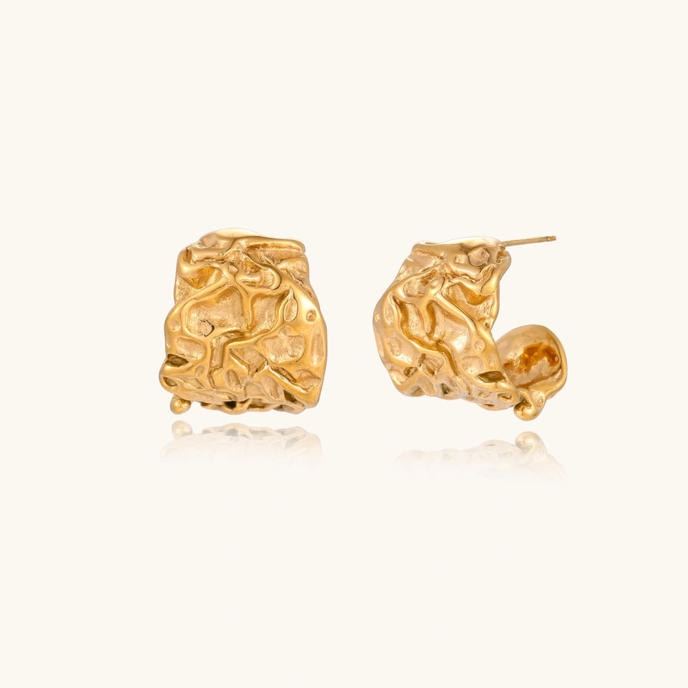Molten Gold Hoops gold-tone earrings on a white studio setting