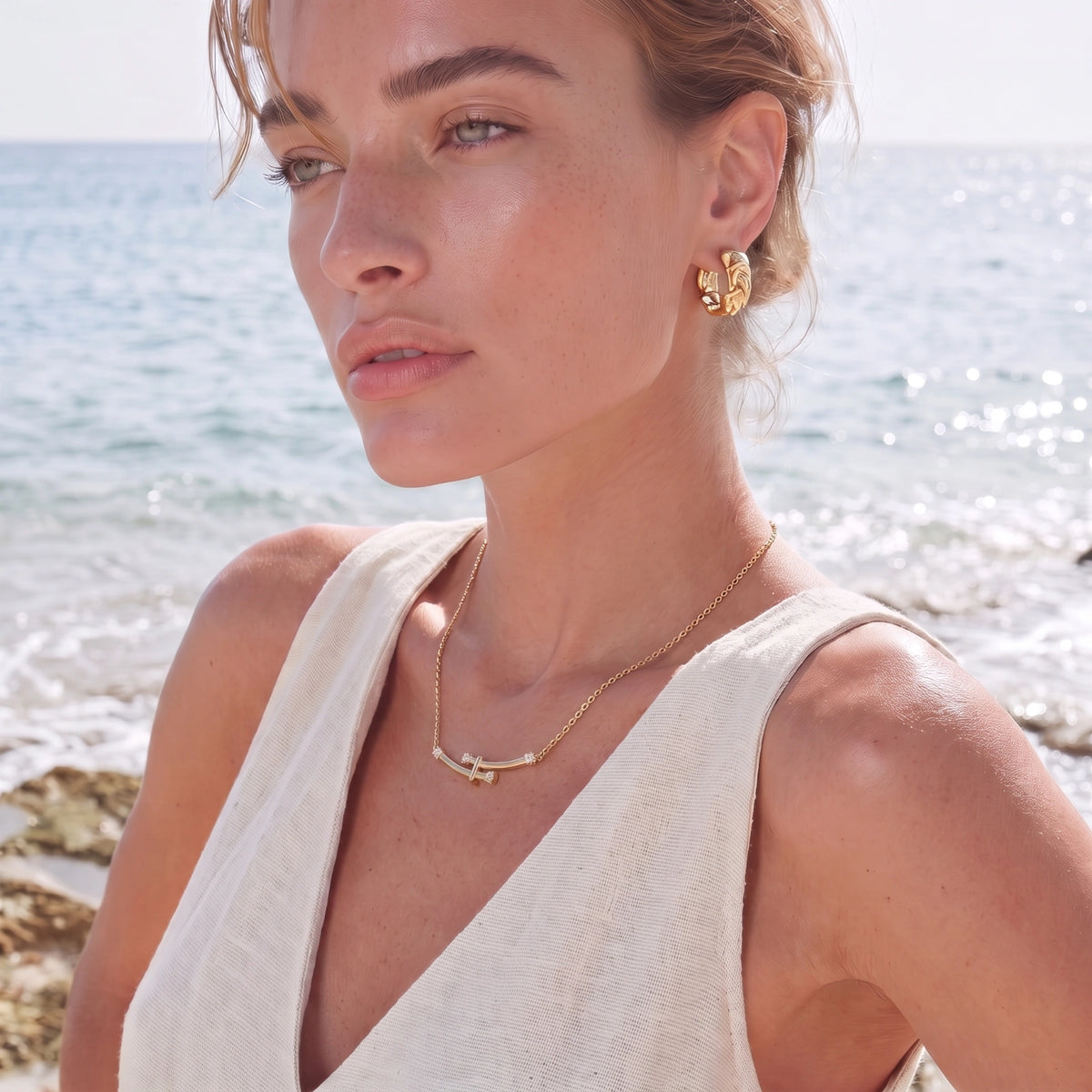 Bamboo Crystal Arc Necklace gold-toned necklace on a female modell
