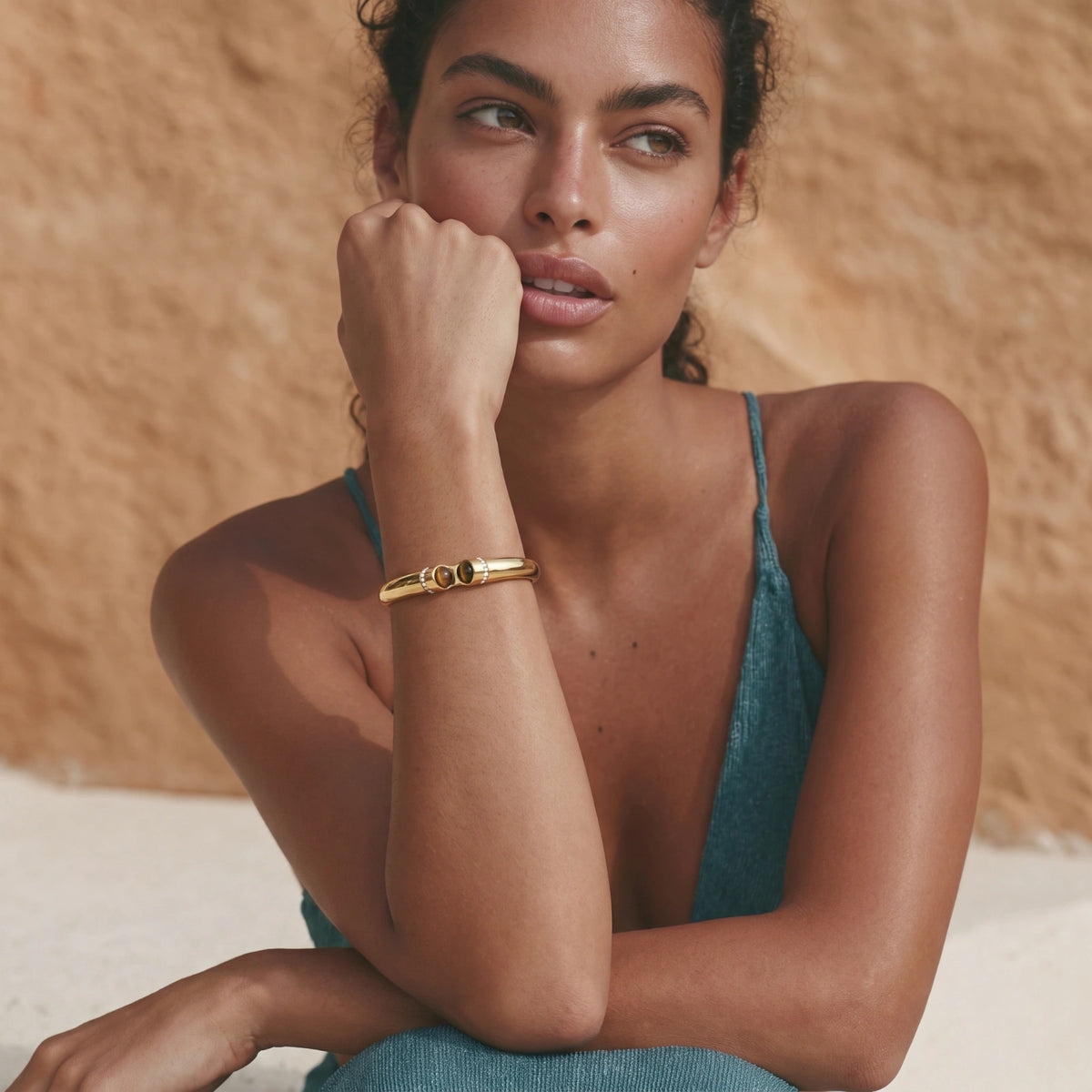 Tiger Eye Bangle gold-toned bracelet on a female model