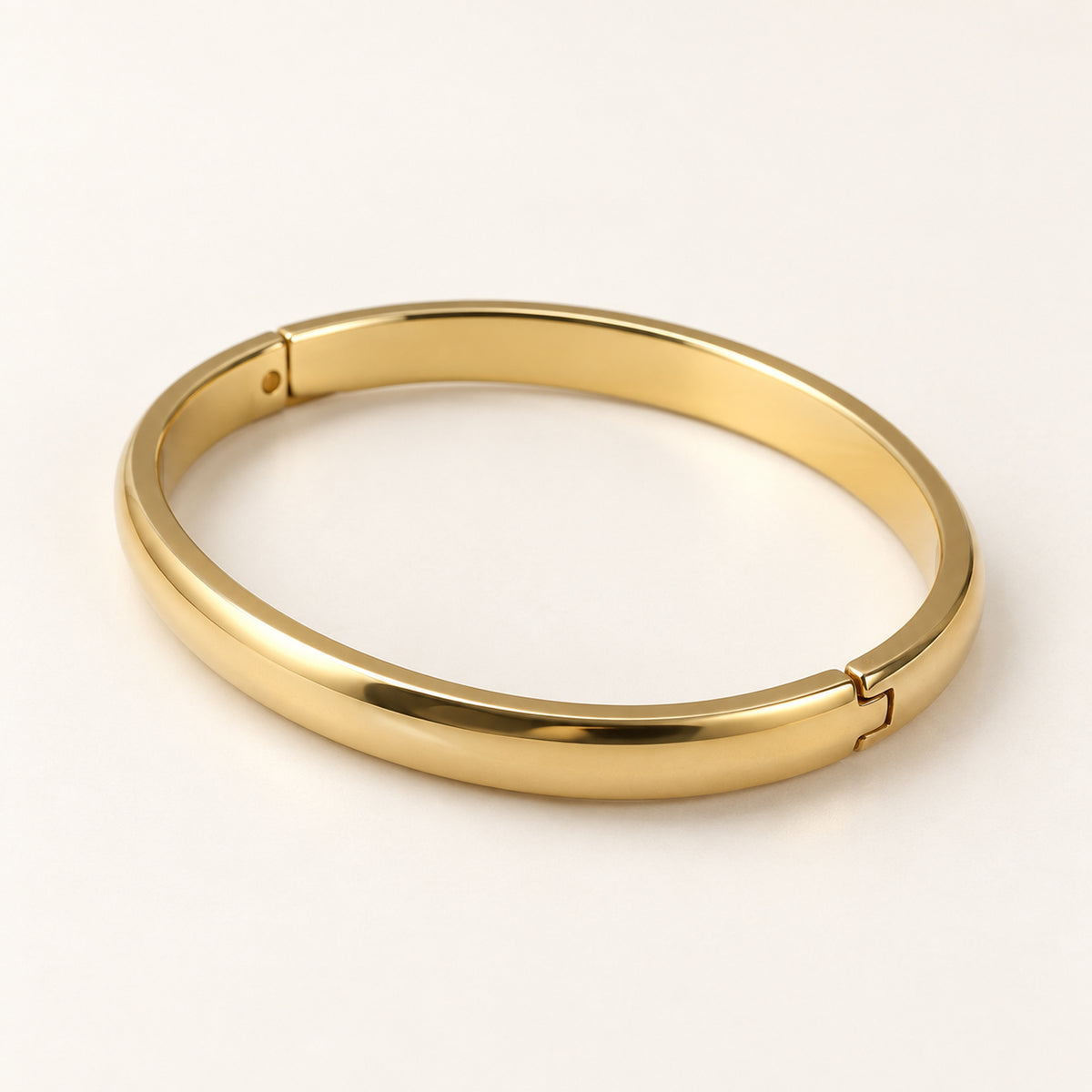 Aurelia Bangle gold-tone bracelet on a white background