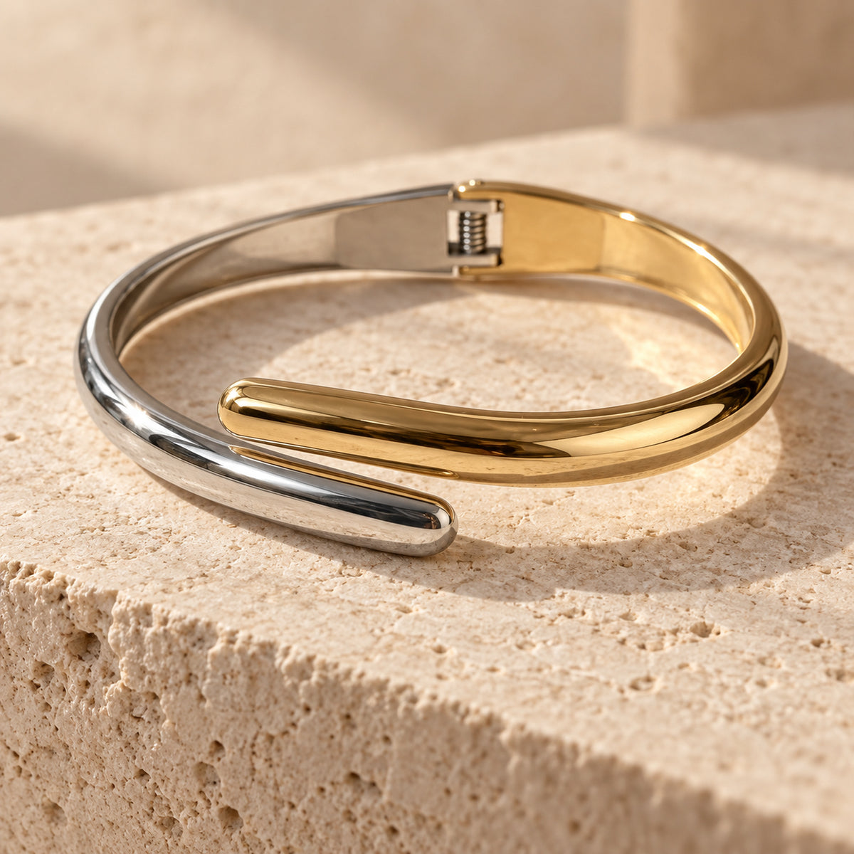 Elara Dual Tone Cuff silver and gold-tone bracelet in a cream tone studio setting