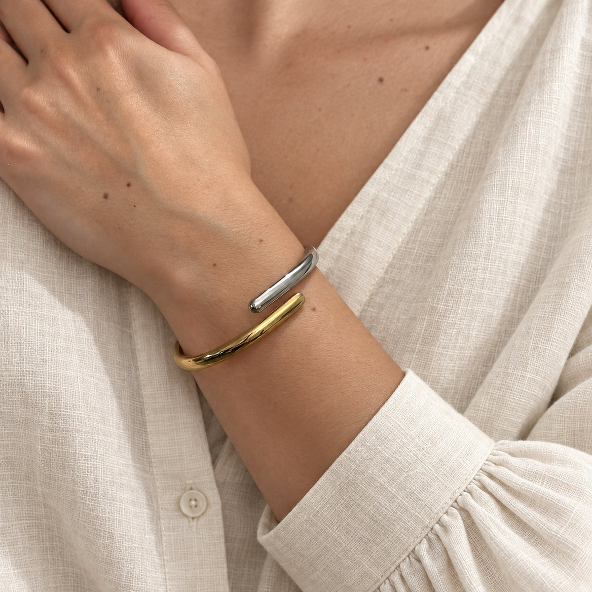 Elara Dual Tone Cuff silver and gold-tone bracelet worn by a female model