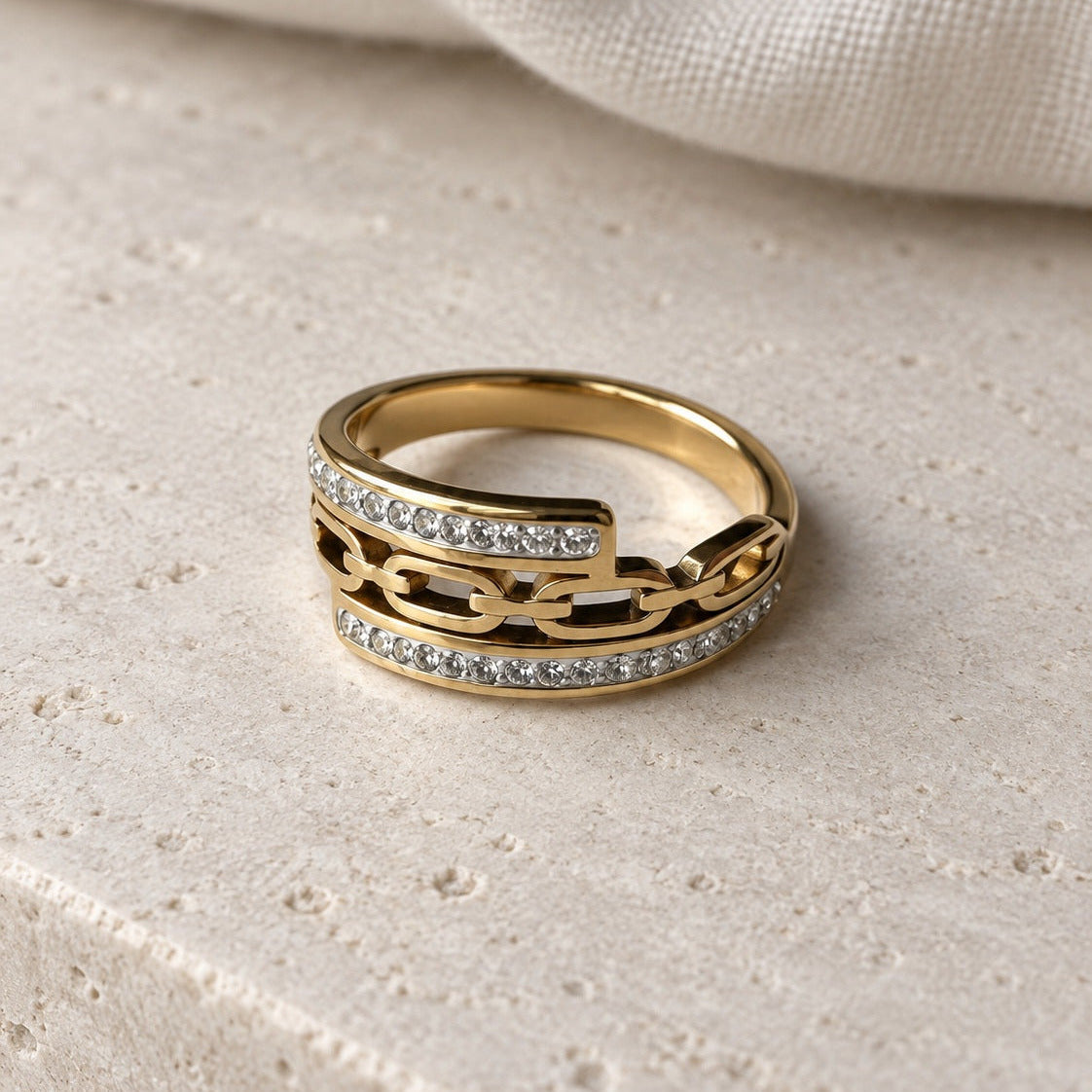 Lia Chain Ring gold-tone chain style ring in a cream studio setting