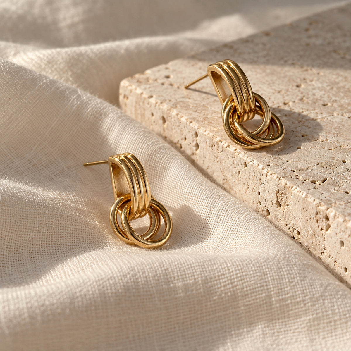 Linea Drop Earrings gold-tone earrings on a white background