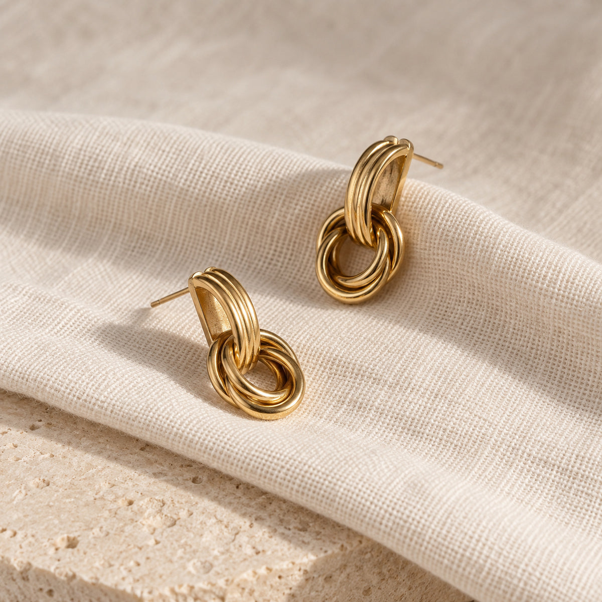 Linea Drop Earrings gold-tone earrings on a white background