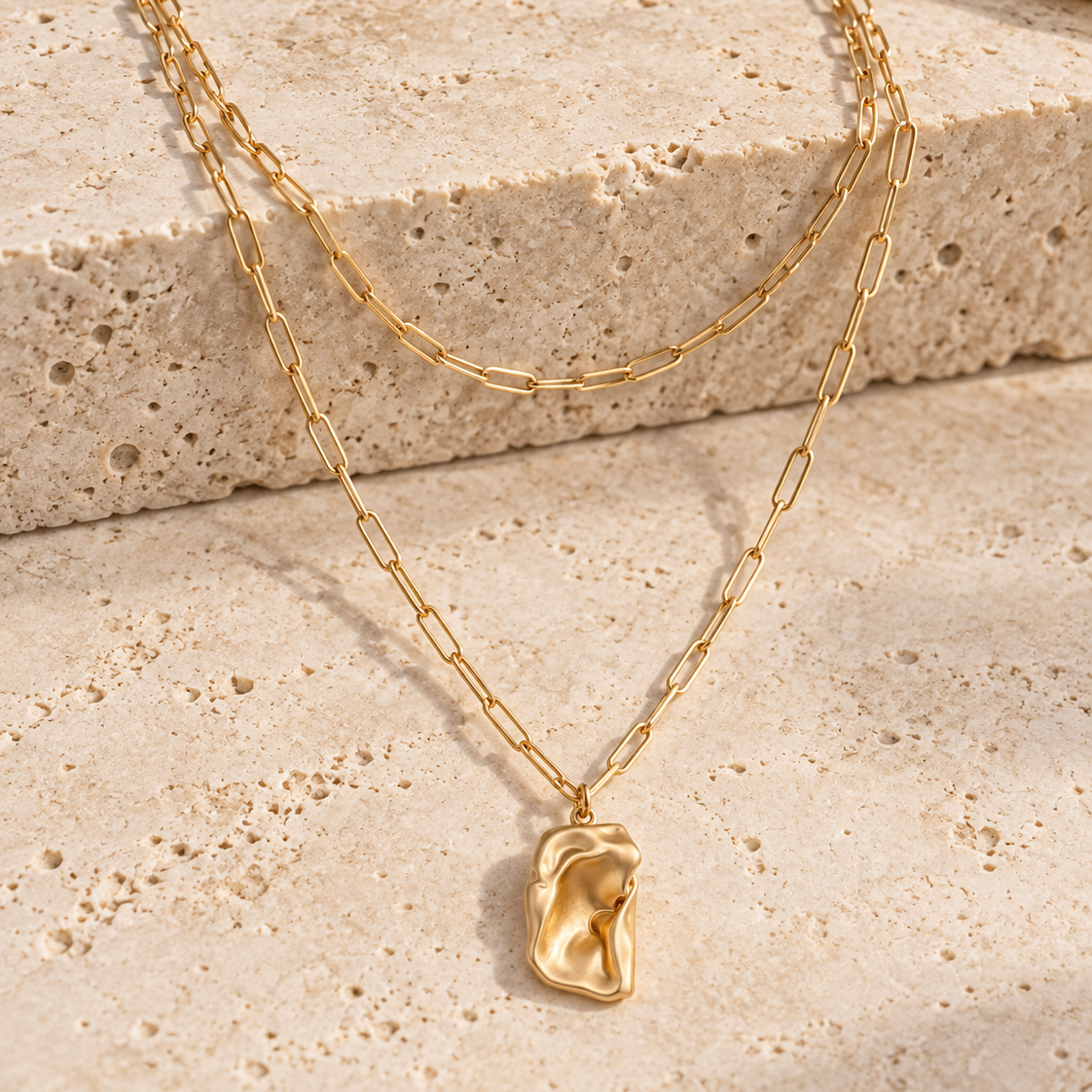 Molten Dreams gold-tone layered necklace on a white background